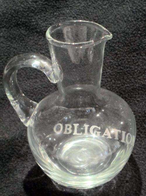 Small jug inscribed `Obligation`